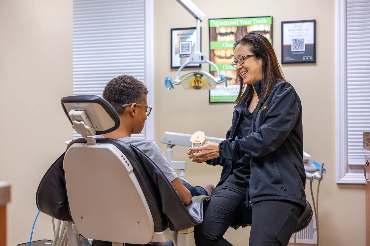 A young patient in the chair with a clinician at South Orange Dental Center